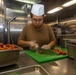 Sailors work in the galley