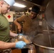 Sailors work in the galley