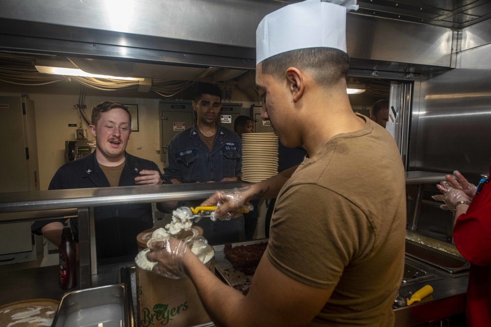 Sailors work in the galley