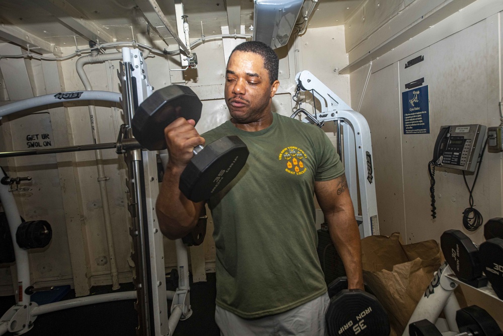 Sailors work out in the gym