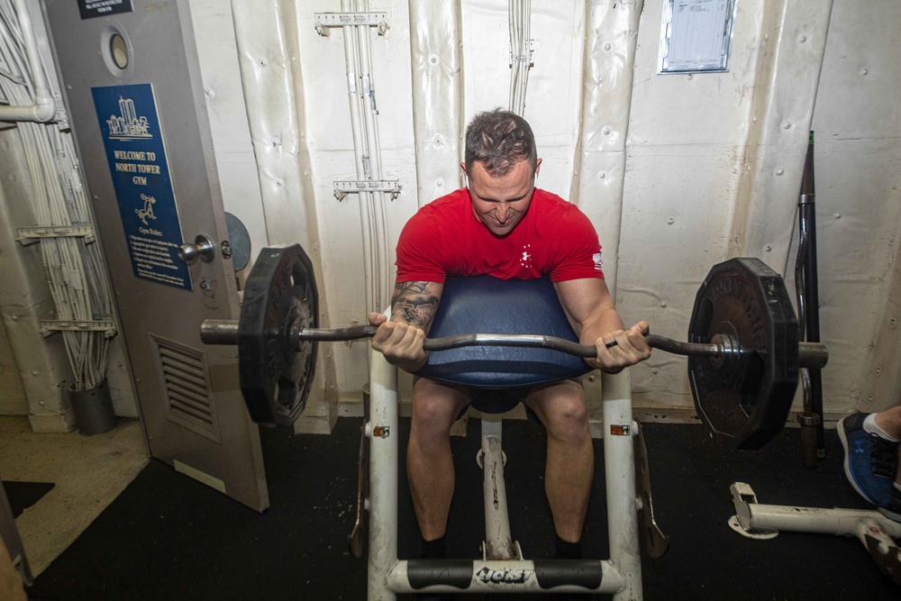 Sailors work out in the gym