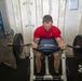 Sailors work out in the gym