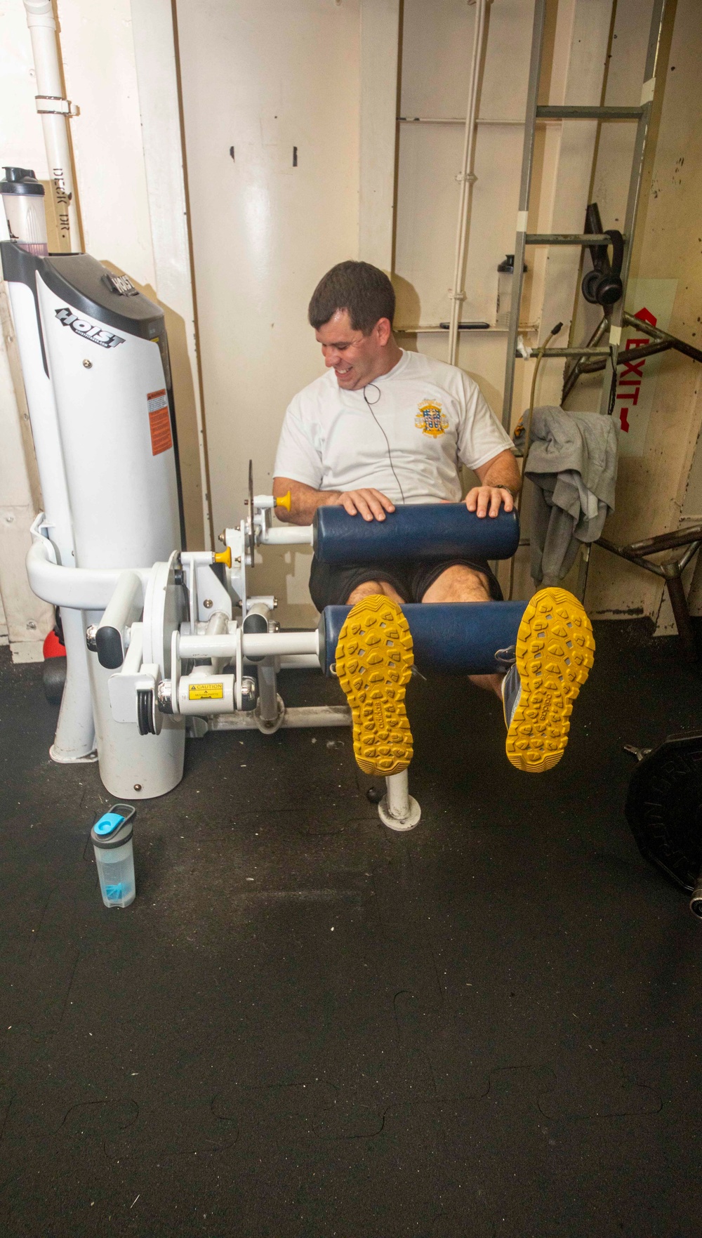 Sailors work out in the gym