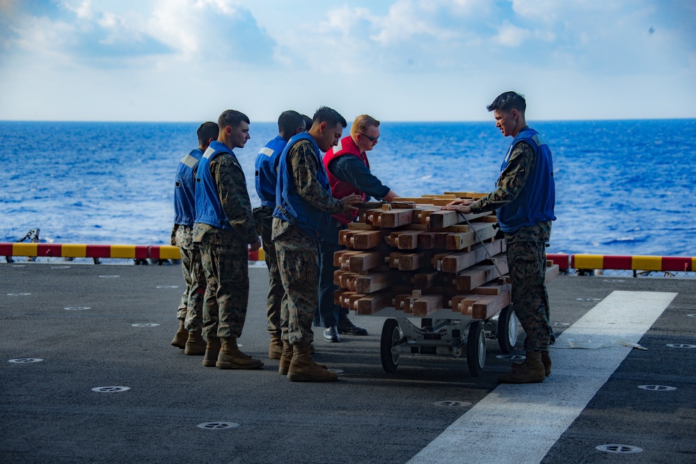 31st MEU Marines and Sailors aboard USS America conduct live fire range