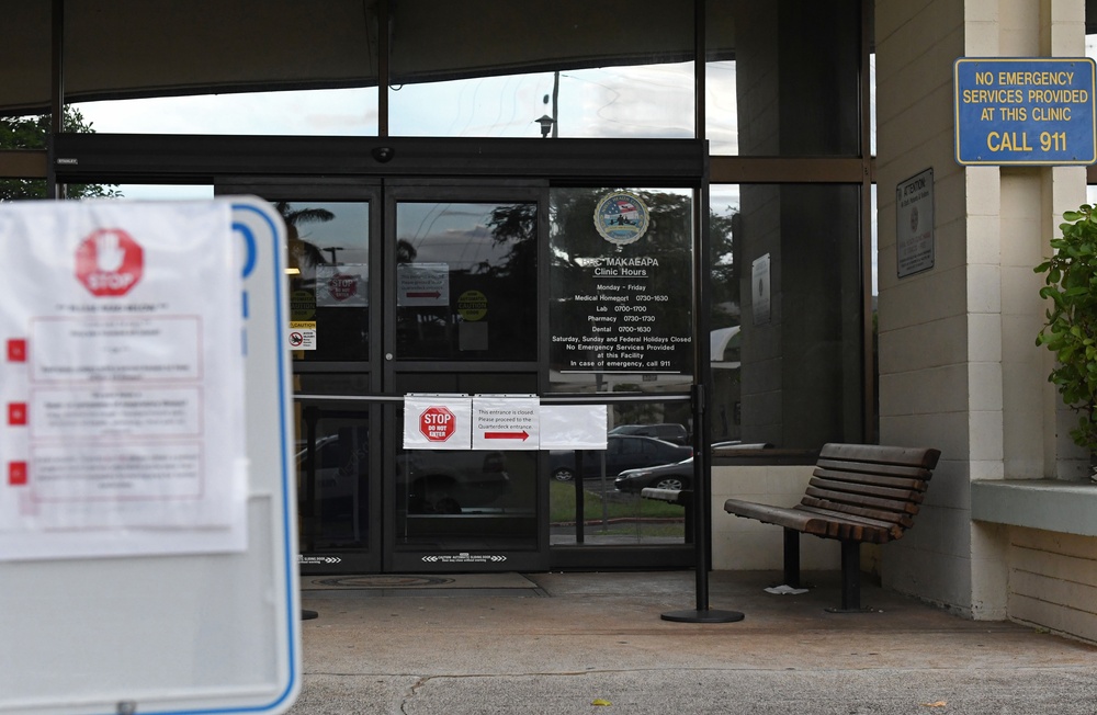 Signs posted outside re-direct patients to screening areas at BHC Makalapa