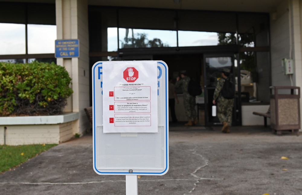 Signs posted outside BHC Makalapa indicate COVID-19 screening procedures