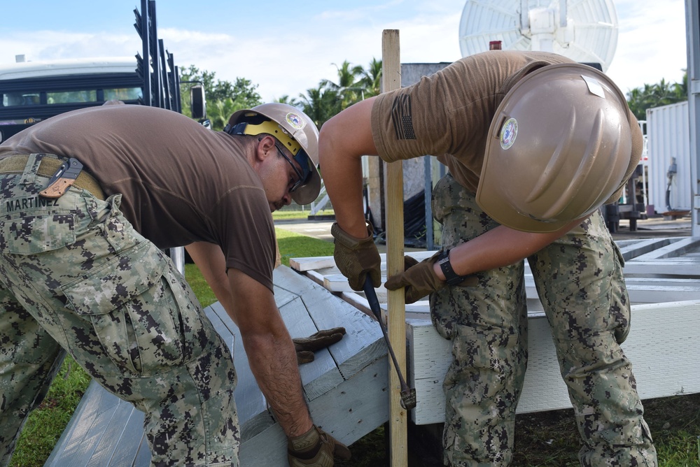 U.S. Navy Seabees from NMCB-5’s Detail Diego Garcia complete a military working dog shelter