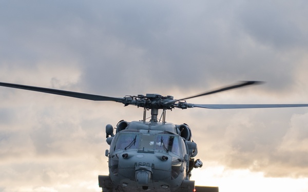 An MH-60S Seahawk conducts a vertical replenishment exercise