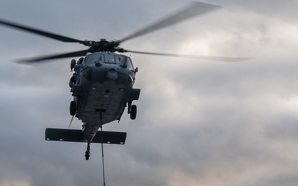 An MH-60S Seahawk conducts a vertical replenishment exercise