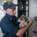 USS Mustin Sailors Install Speaker
