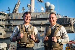 Childhood Friends Serve Together Aboard Deployed Aircraft Carrier