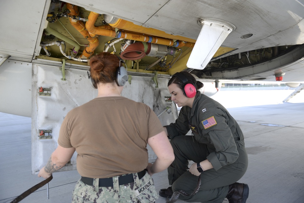 Lt. Jensen, AT3 Mckenzie Perform Pre-flight Walk Around Inspection