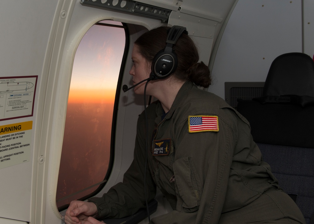 AWO2 Meghan Cooke Looks Out of P-8A Observer Window