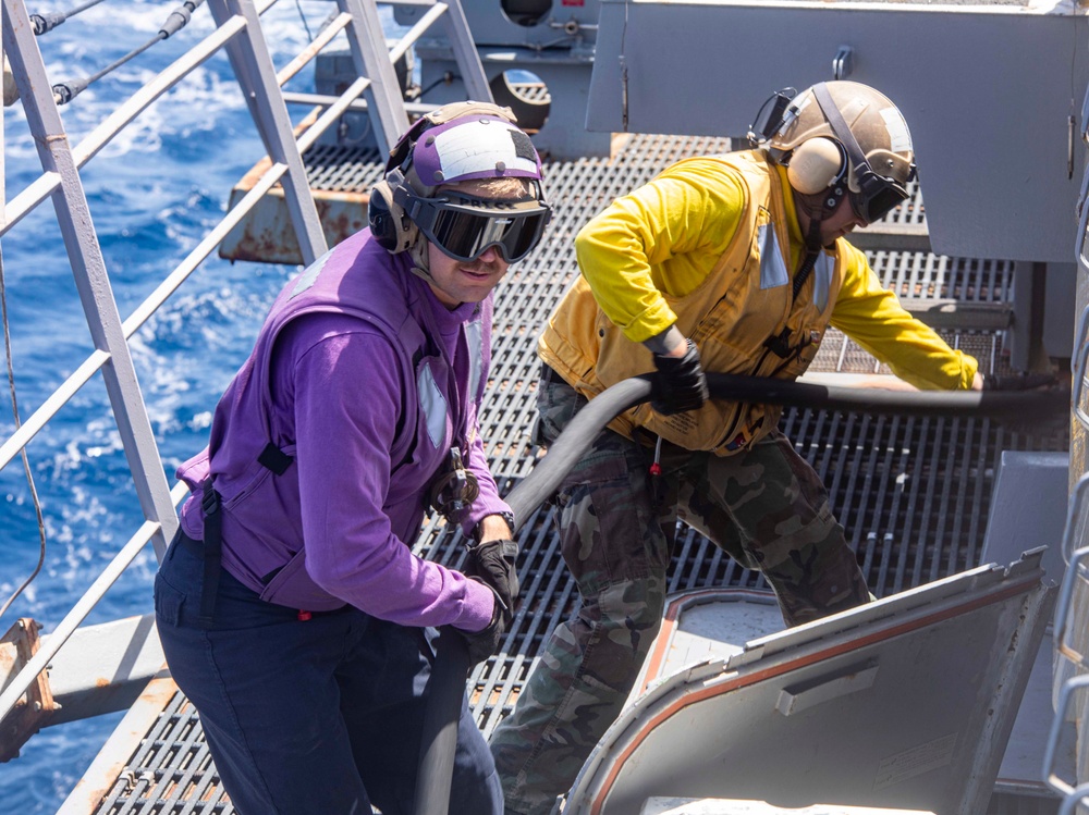 Sailors take part in flight deck fire fighting drills