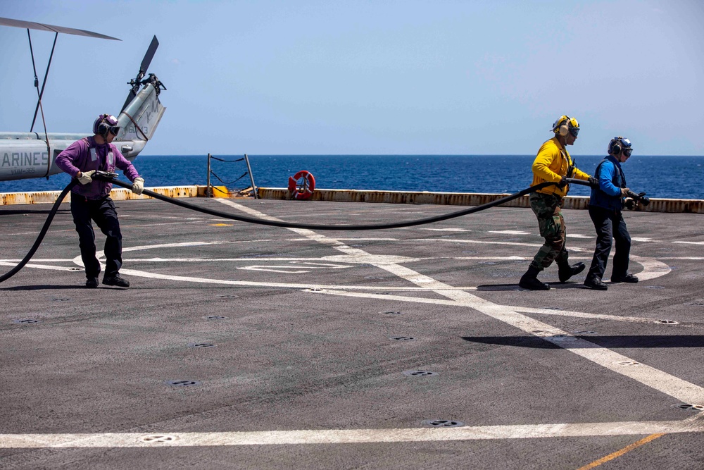 Sailors take part in flight deck fire fighting drills