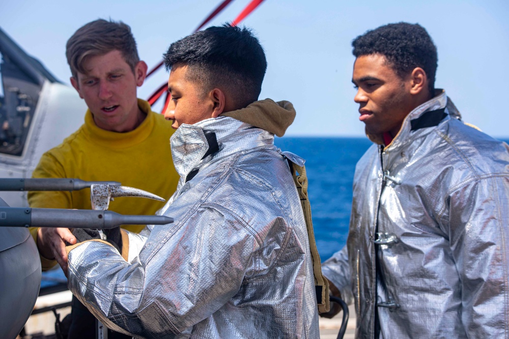 Sailors take part in flight deck fire fighting drills