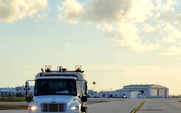 An airfield sweeper truck cleans NAS Key West