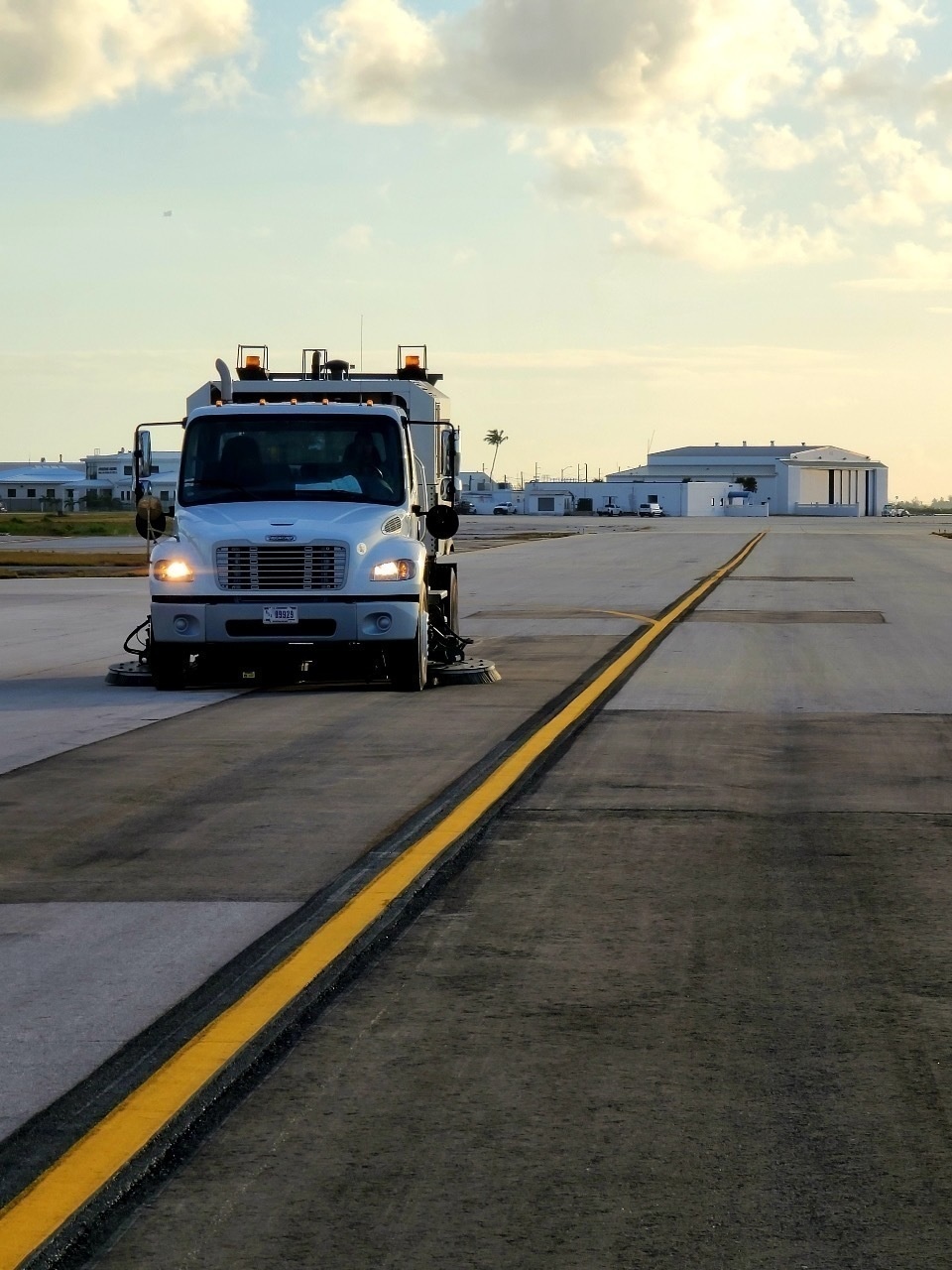 An airfield sweeper truck cleans NAS Key West