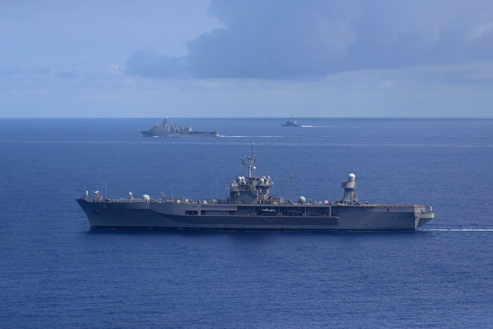 Ships from the Theodore Roosevelt Carrier Strike Group, the America Expeditionary Strike Group, and the U.S. 7th Fleet command ship, USS Blue Ridge (LCC 19), transit the Philippine Sea