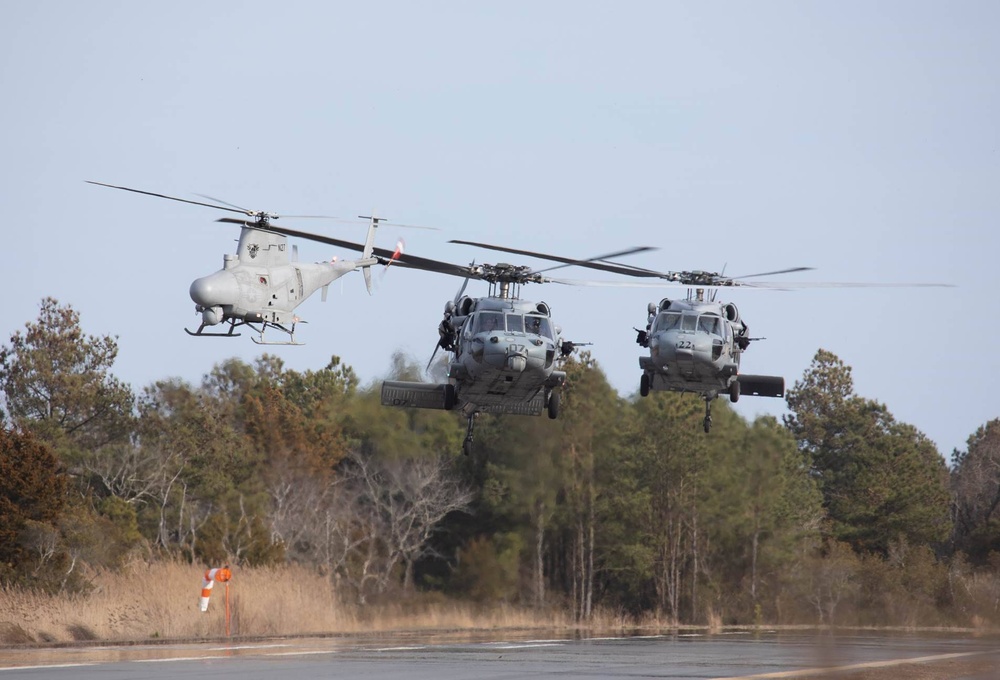 MH-60S and MQ-8B conduct hover checks