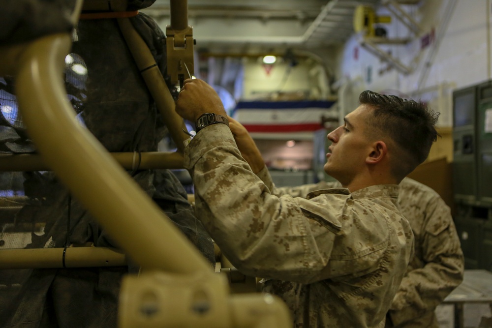 Marines work aboard USS Bataan