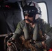 U.S. Sailor performs tasks in MH-60S Sea Hawk