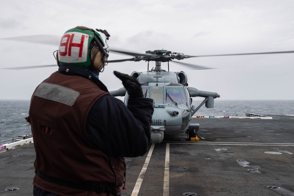 U.S. Sailor shuts down an MH-60S Sea Hawk