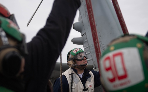 U.S. Sailor observes shut-down operations of MH-60S Sea Hawk