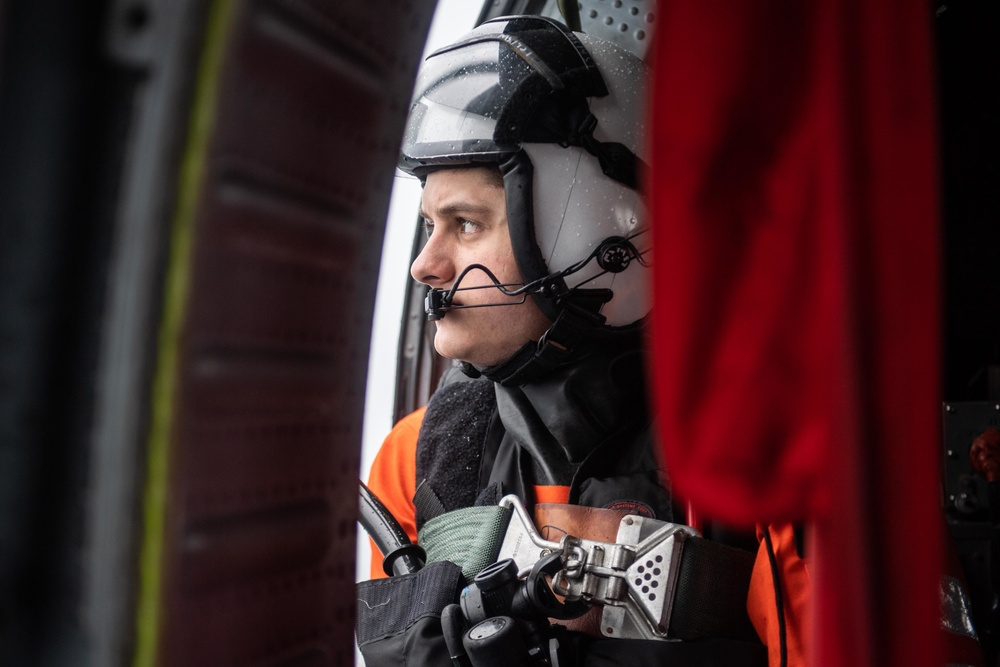 U.S. Sailor observes flight operations