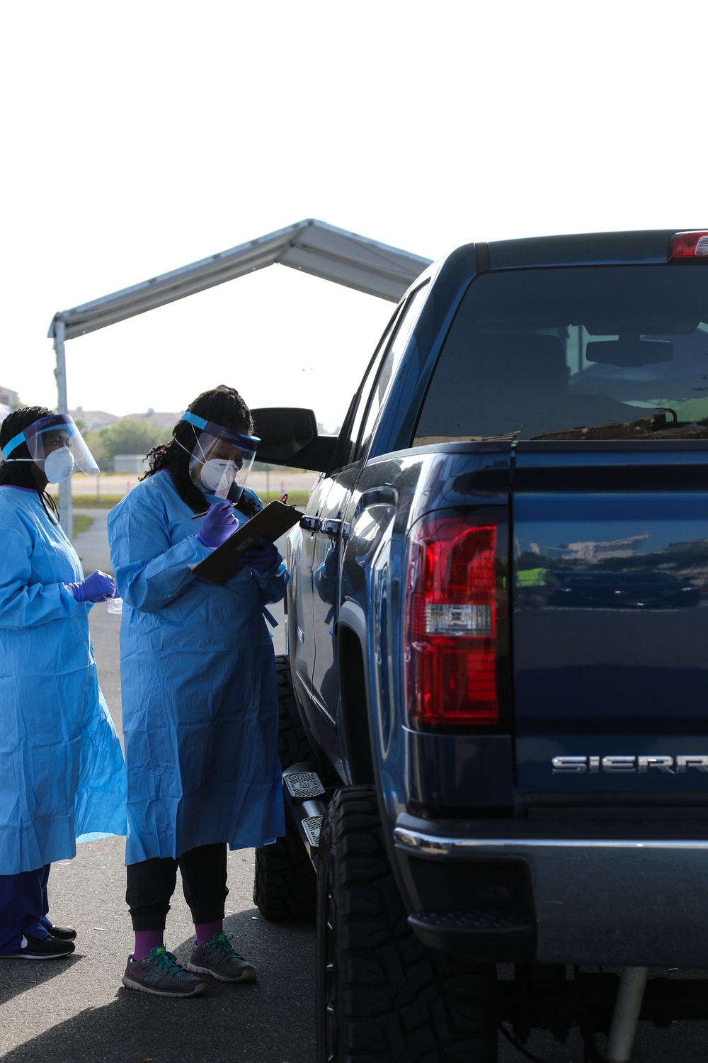 Nurses work as part of multi-agency at Orange County testing site's screening Area