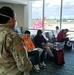 Florida Department of Health and Florida National Guard Soldiers work together at Orlando International Airport.