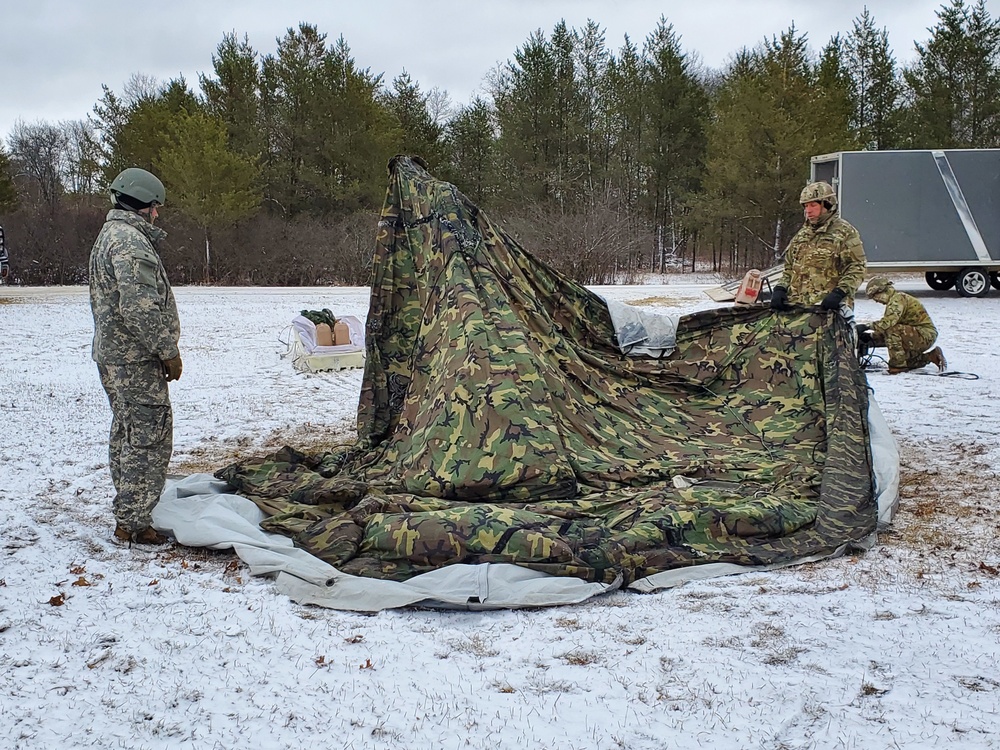 Cold-Weather Operations Course Class 20-05 students build Arctic 10-person tents