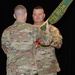 Garrison Commander passes the colors to Command Sgt. Maj. Fogle