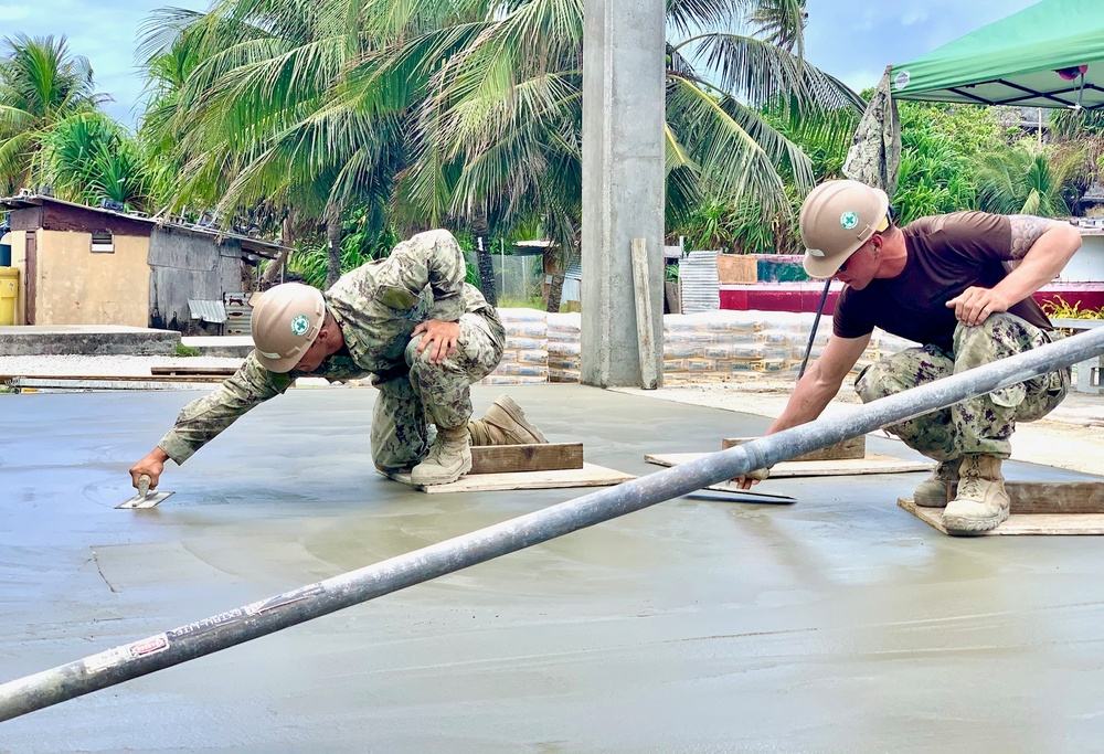 U.S. Navy Seabees with NMCB-5's Detail Marshall Islands continue work on the Ennibur Evacuation Center
