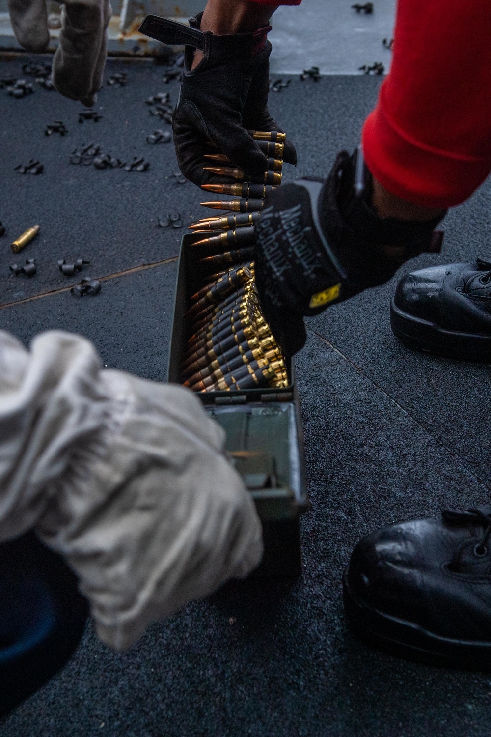 Sailors aboard USS America (LHA 6) conduct live fire exercise