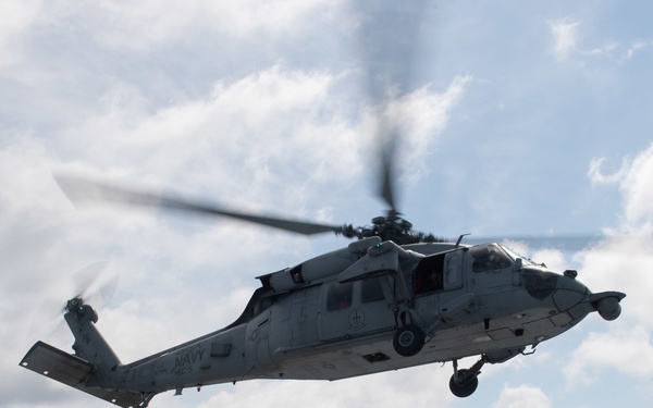 MH-60S Sea Hawk takes off from the flight deck of the aircraft carrier USS Gerald R. Ford