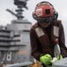 U.S. Sailor does maintenance on an MH-60S Sea Hawk