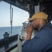 Sailor stands watch on the bridge