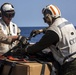 Sailors and Marines take part in a replenishment-at-sea