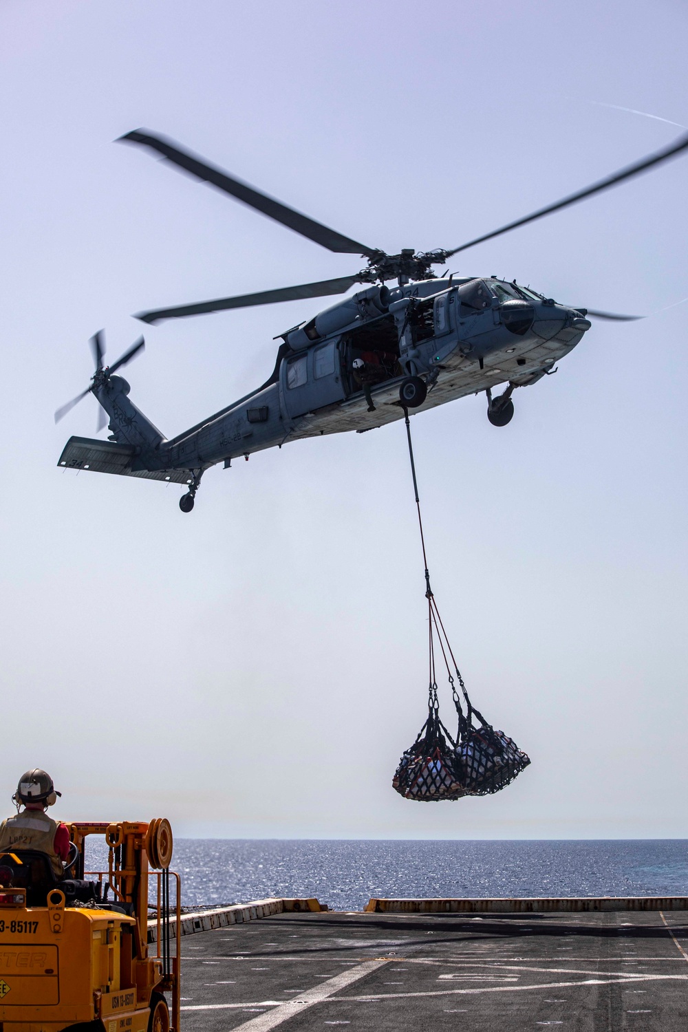 Sailors and Marines take part in a replenishment-at-sea