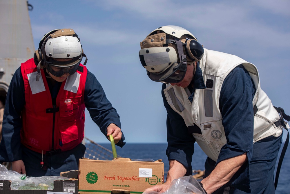 Sailors and Marines take part in a replenishment-at-sea