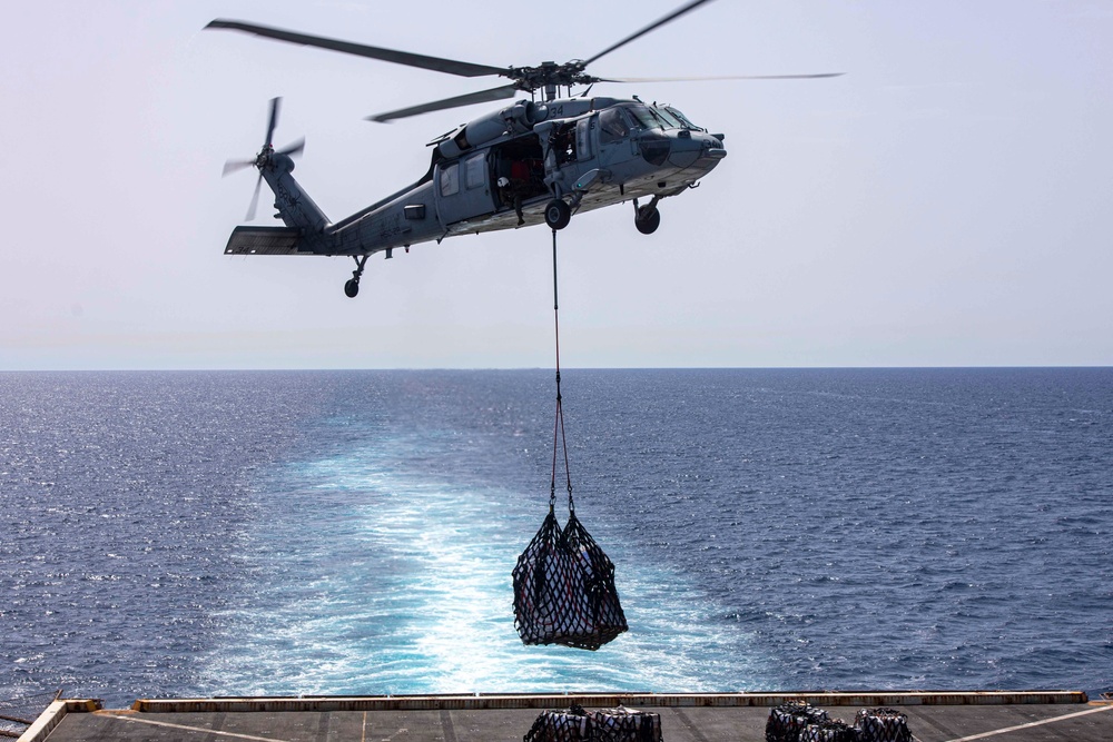 Sailors and Marines take part in a replenishment-at-sea