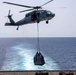 Sailors and Marines take part in a replenishment-at-sea