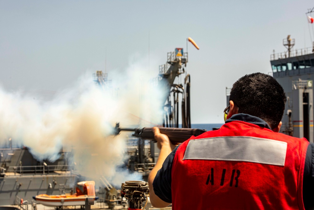 Sailors and Marines take part in a replenishment-at-sea