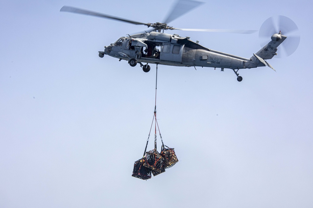 Sailors and Marines take part in a replenishment-at-sea