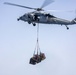 Sailors and Marines take part in a replenishment-at-sea