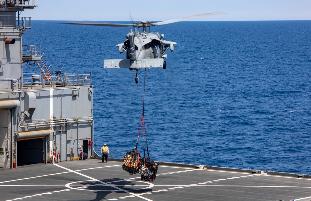 Sailors and Marines take part in a replenishment-at-sea