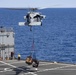 Sailors and Marines take part in a replenishment-at-sea