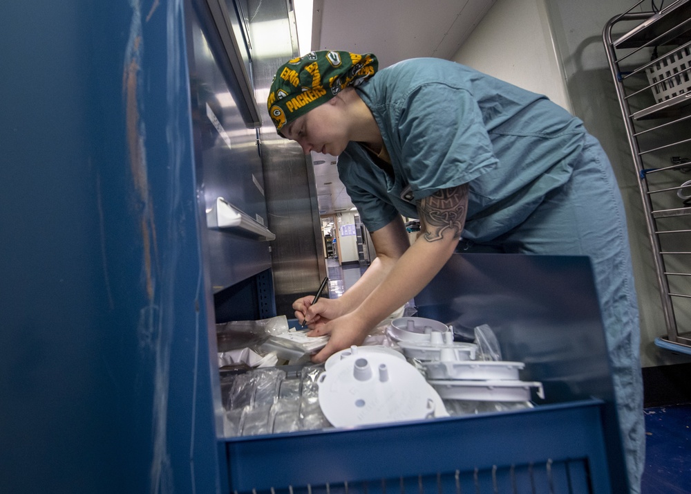 USNS Mercy Sailor Takes Inventory of Medical Supplies