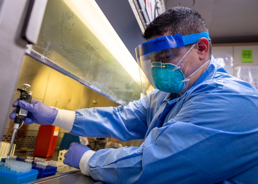 USNS Mercy Sailor Takes Test Sample in the Micro Laboratory